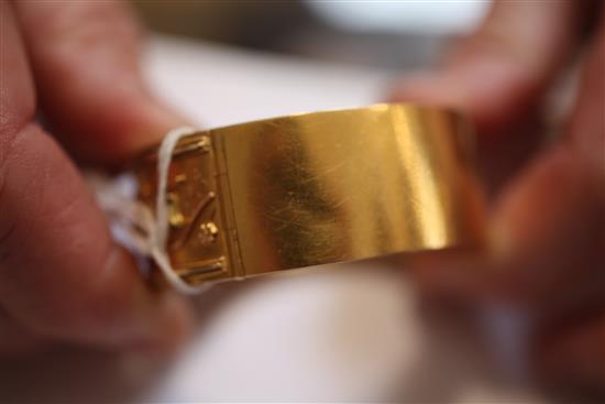 A Victorian gold hinged bracelet, in gilt tooled leather box.